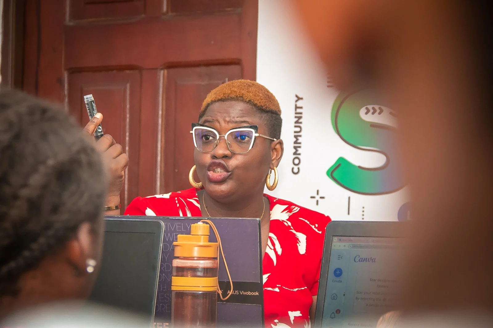 Oluwadara teaching participants during a practical digital marketing session