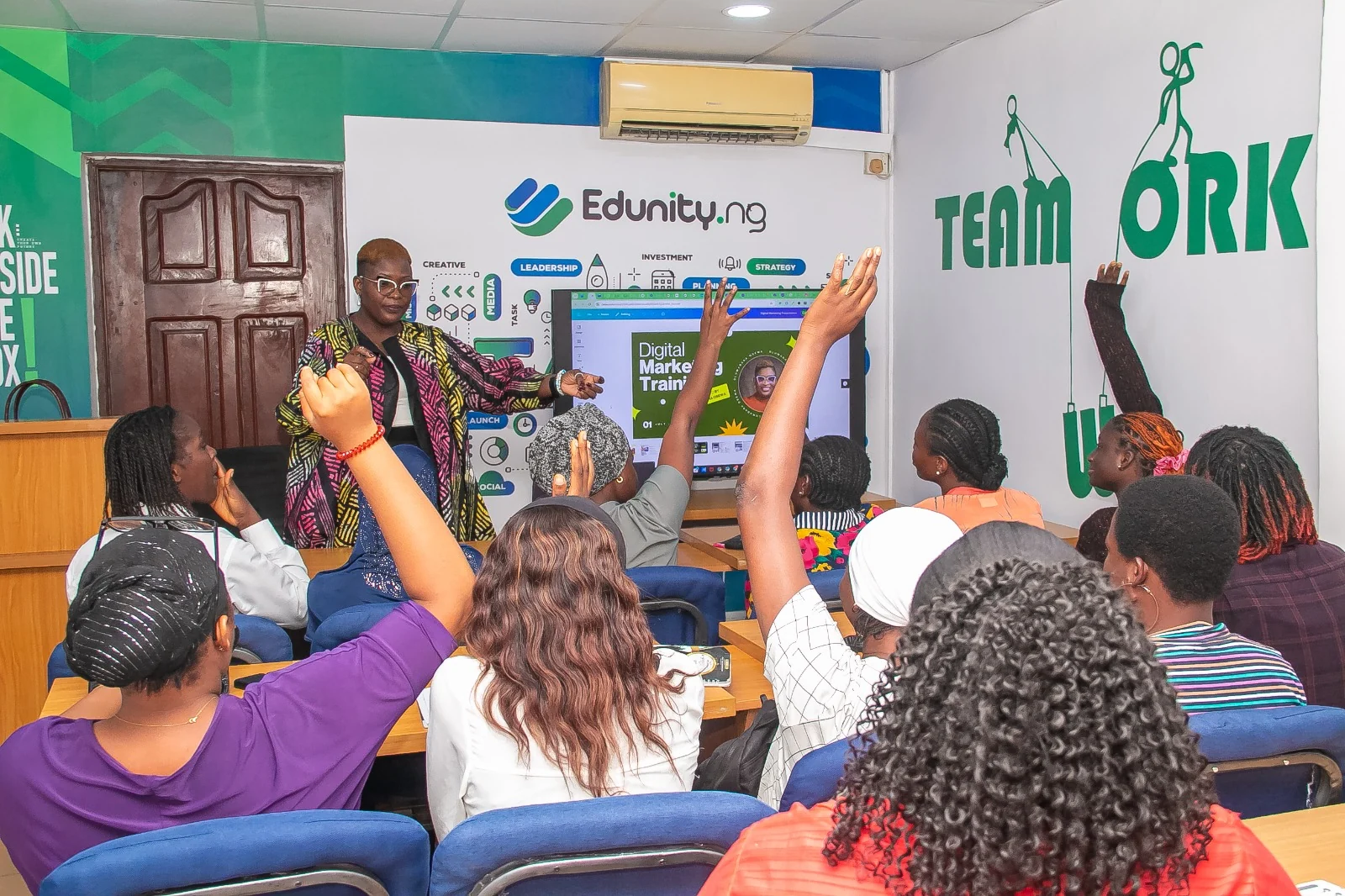 Oluwadara delivering digital marketing training to a group